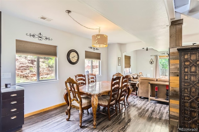 220 Wark Ave, Berthoud, CO 80513 - dining room with dark wood-style flooring and baseboards