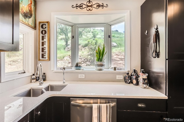 220 Wark Ave, Berthoud, CO 80513 - kitchen with dishwasher, a sink, plenty of natural light, and dark cabinets