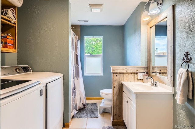 220 Wark Ave, Berthoud, CO 80513 - full bathroom with separate washer and dryer, a textured wall, vanity, toilet, and tile patterned flooring