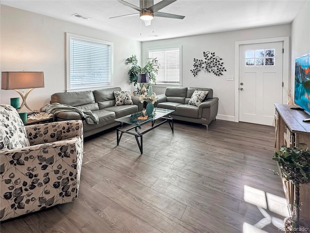 living room featuring hardwood / wood-style flooring and ceiling fan