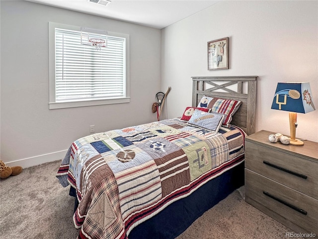 bedroom featuring visible vents, baseboards, and carpet floors