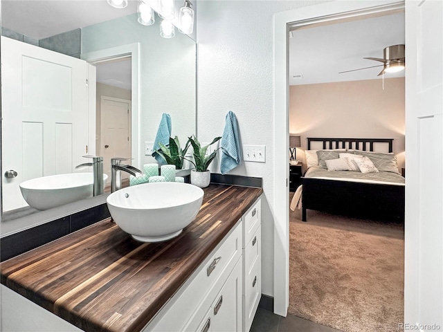 bathroom with ceiling fan and vanity