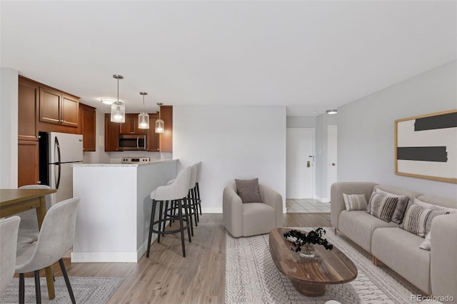 480 S Marion Pkwy Unit 802, Denver, CO 80209 - living area featuring light wood-style floors and baseboards