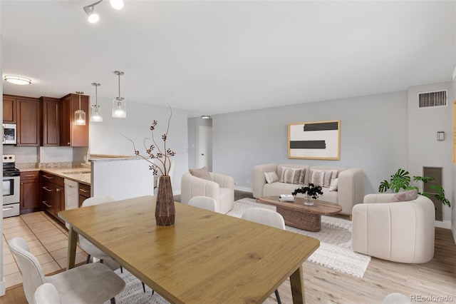480 S Marion Pkwy Unit 802, Denver, CO 80209 - dining area with light wood-type flooring