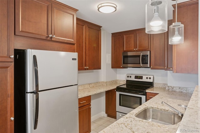 480 S Marion Pkwy Unit 802, Denver, CO 80209 - kitchen featuring stainless steel appliances, a sink, light tile patterned floors, and light stone countertops