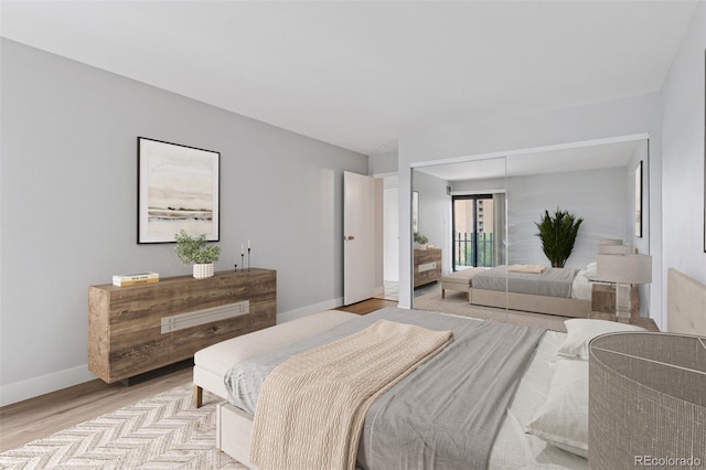 480 S Marion Pkwy Unit 802, Denver, CO 80209 - bedroom with light wood-style flooring and baseboards