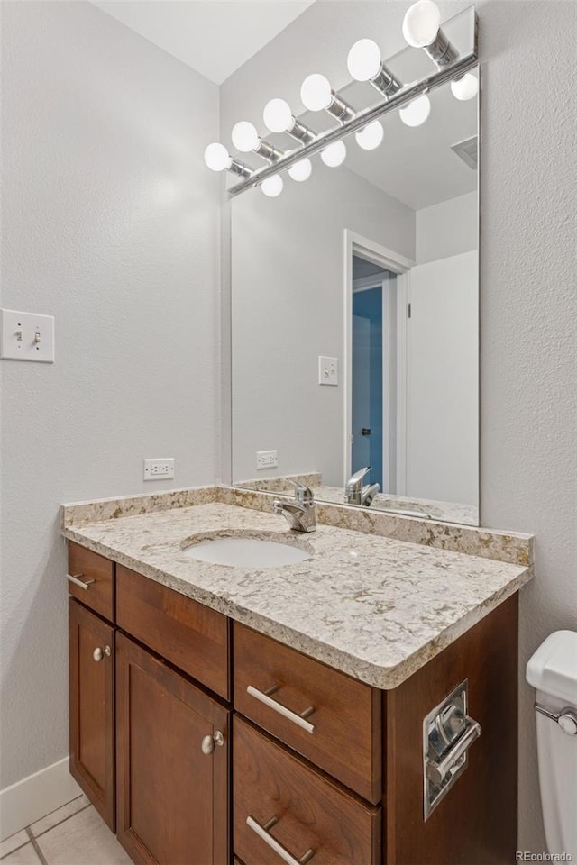 480 S Marion Pkwy Unit 802, Denver, CO 80209 - half bath featuring vanity, toilet, tile patterned floors, and baseboards