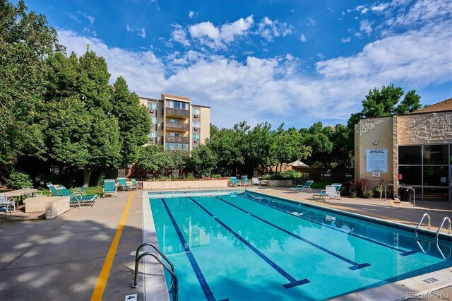 3465 S Poplar St Unit 506, Denver, CO 80224 - community pool featuring a patio