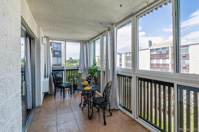 3465 S Poplar St Unit 506, Denver, CO 80224 - sunroom / solarium featuring healthy amount of natural light, tile patterned floors, and a textured ceiling