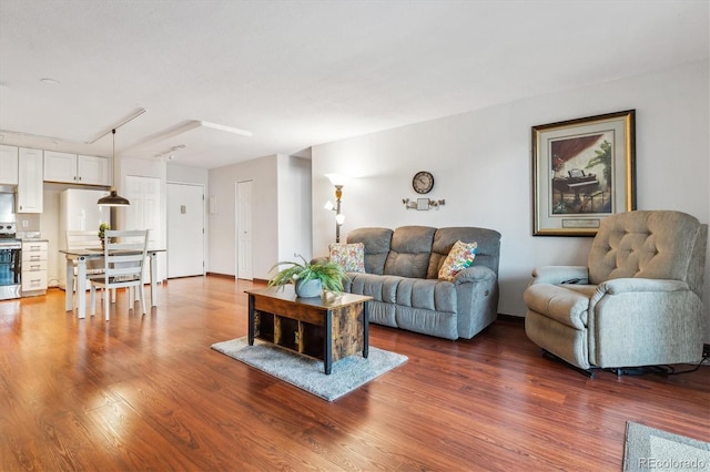 3465 S Poplar St Unit 506, Denver, CO 80224 - living area featuring wood finished floors