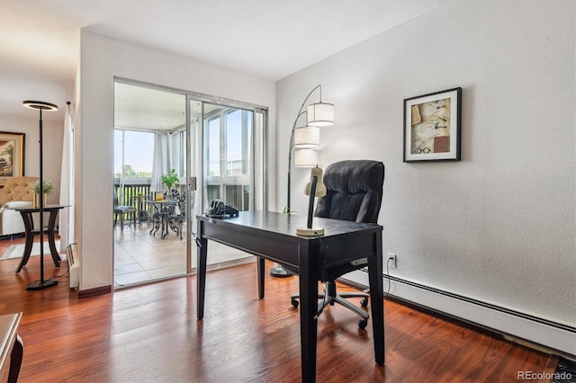 3465 S Poplar St Unit 506, Denver, CO 80224 - office area with baseboard heating and wood finished floors