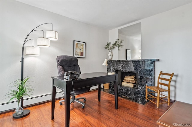 3465 S Poplar St Unit 506, Denver, CO 80224 - office area with a fireplace and wood finished floors