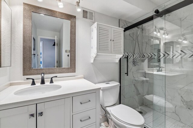 3465 S Poplar St Unit 506, Denver, CO 80224 - full bath featuring a textured wall, vanity, and a marble finish shower
