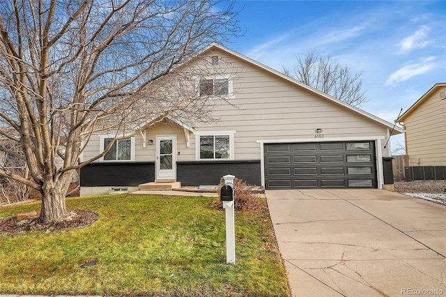 view of front facade with a front lawn and a garage