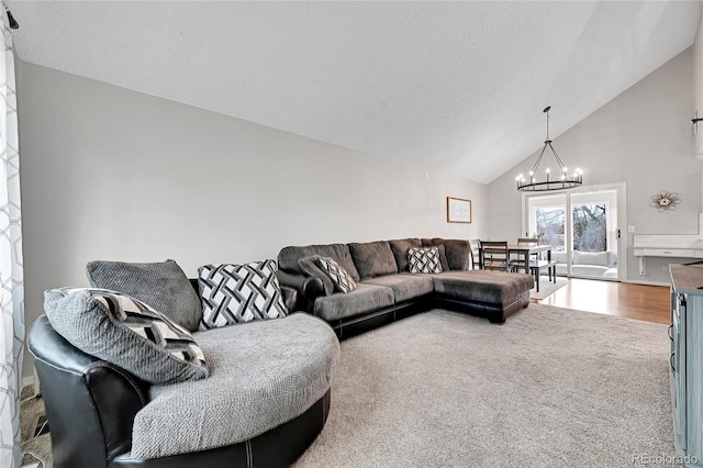 living room with carpet flooring, vaulted ceiling, and a notable chandelier