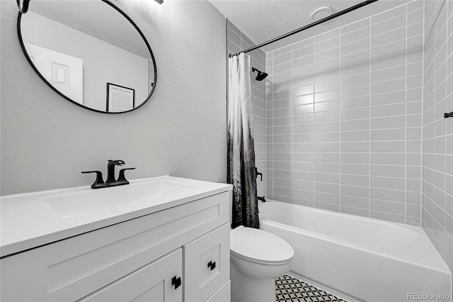 full bathroom with vanity, toilet, and shower / tub combo