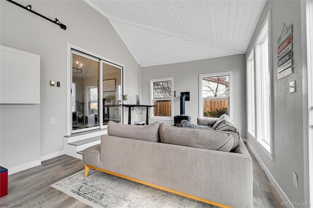 living room featuring dark hardwood / wood-style floors, lofted ceiling, and wood ceiling