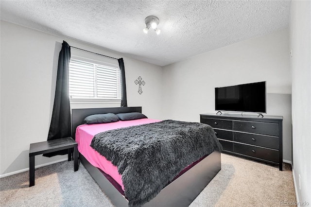 carpeted bedroom with a textured ceiling