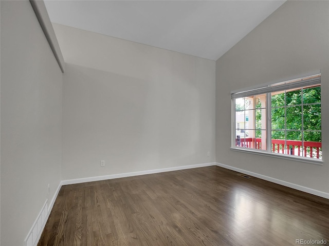 1288 S Beeler Ct, Denver, CO 80247 - spare room with dark wood-type flooring and high vaulted ceiling