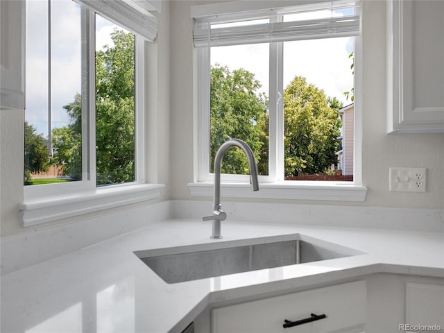 1288 S Beeler Ct, Denver, CO 80247 - kitchen view of light countertops and white cabinets