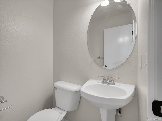 1288 S Beeler Ct, Denver, CO 80247 - bathroom with toilet and a sink