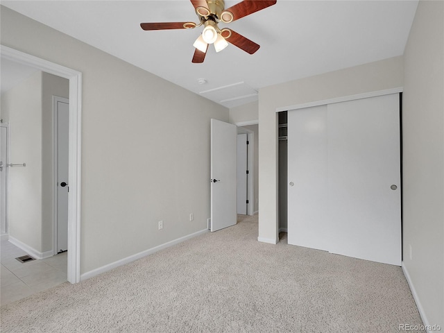 1288 S Beeler Ct, Denver, CO 80247 - unfurnished bedroom with light colored carpet, a closet, and a ceiling fan
