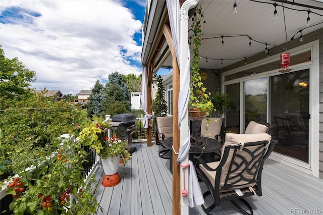 wooden deck with area for grilling