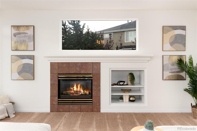 interior details featuring a fireplace, carpet, and built in features