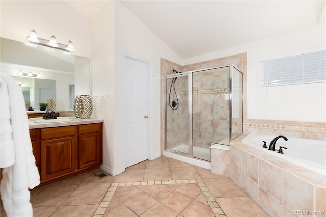 bathroom with tile patterned flooring, vanity, lofted ceiling, and shower with separate bathtub