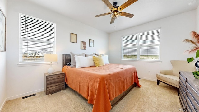 13488 Wabash St, Thornton, CO 80602 - bedroom with light colored carpet, baseboards, and ceiling fan