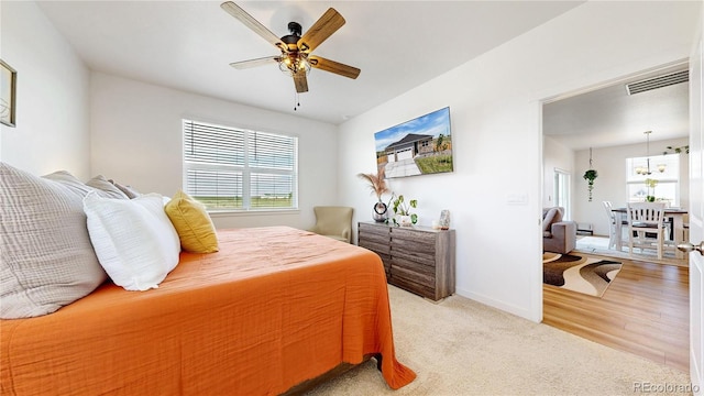 13488 Wabash St, Thornton, CO 80602 - bedroom with light colored carpet, baseboards, and a ceiling fan
