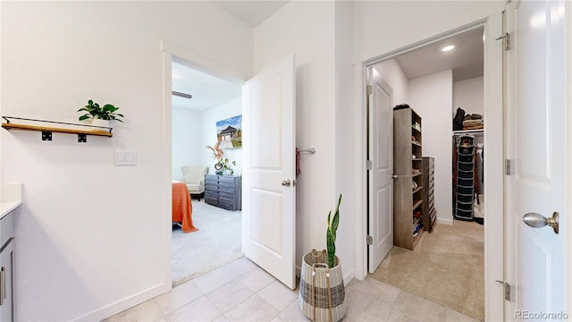 13488 Wabash St, Thornton, CO 80602 - hall with light carpet, light tile patterned flooring, and baseboards