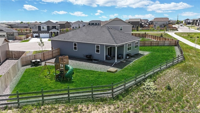 13488 Wabash St, Thornton, CO 80602 - back of property featuring a residential view, roof with shingles, a playground, and a patio