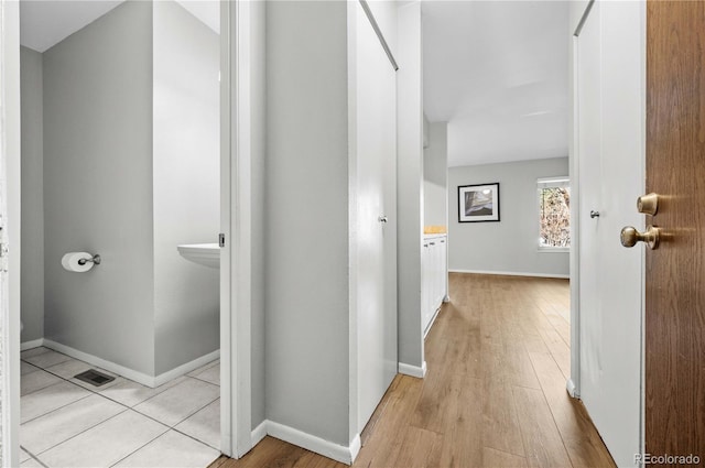 hallway with light wood-type flooring