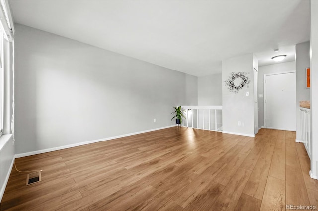 unfurnished room featuring light wood-type flooring