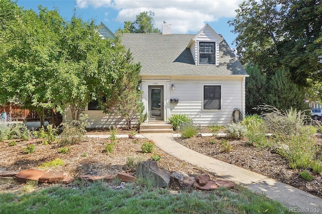 1100 W Mulberry St, Fort Collins, CO 80521 - view of front of home with a shingled roof and a chimney