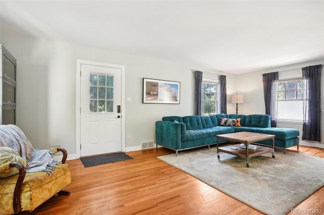1100 W Mulberry St, Fort Collins, CO 80521 - living room with baseboards, light wood-type flooring, and visible vents