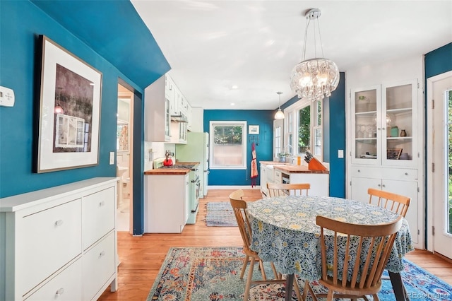 1100 W Mulberry St, Fort Collins, CO 80521 - dining area with light wood-style flooring and a chandelier