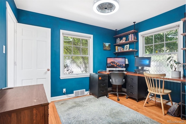 1100 W Mulberry St, Fort Collins, CO 80521 - office featuring visible vents, wood finished floors, and a healthy amount of sunlight