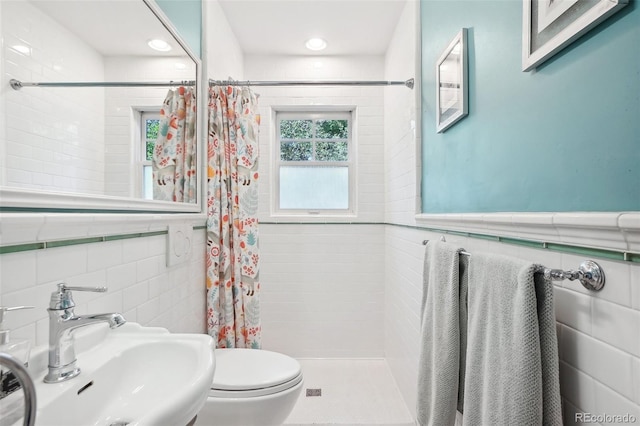 1100 W Mulberry St, Fort Collins, CO 80521 - bathroom with toilet, tile walls, a tile shower, and a sink