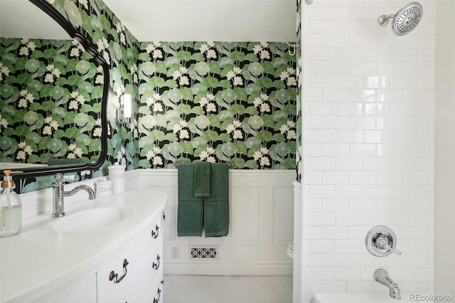 1100 W Mulberry St, Fort Collins, CO 80521 - full bath featuring vanity, bathtub / shower combination, a decorative wall, tile patterned floors, and a wainscoted wall