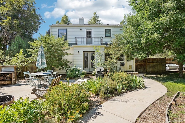 1100 W Mulberry St, Fort Collins, CO 80521 - back of house with a patio, fence, a chimney, and a balcony