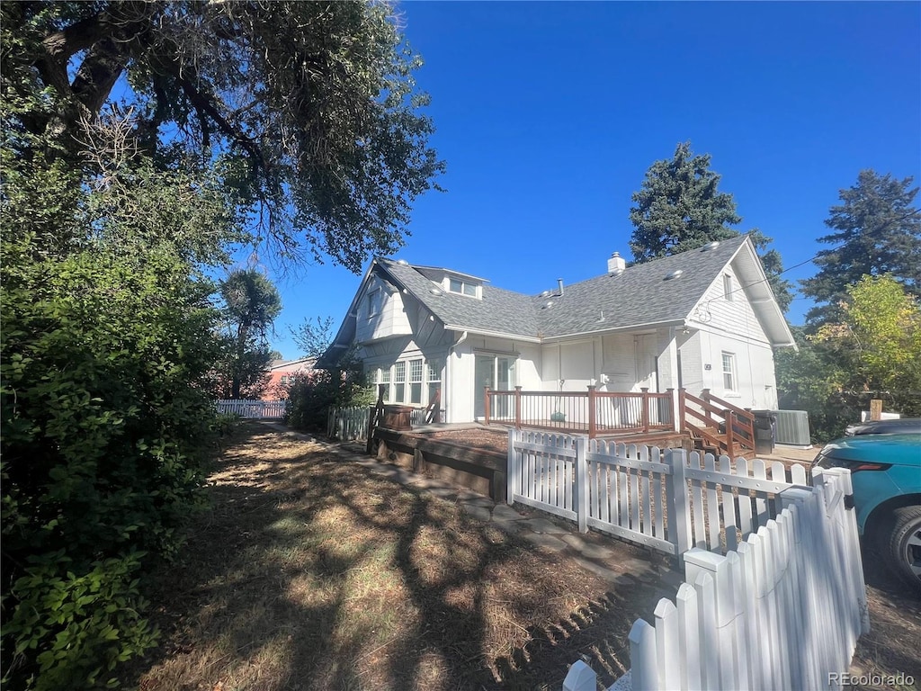 rear view of property with a deck