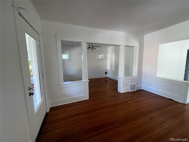 spare room featuring ceiling fan and dark hardwood / wood-style floors