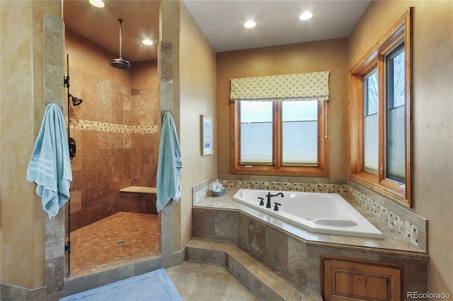 bathroom with shower with separate bathtub