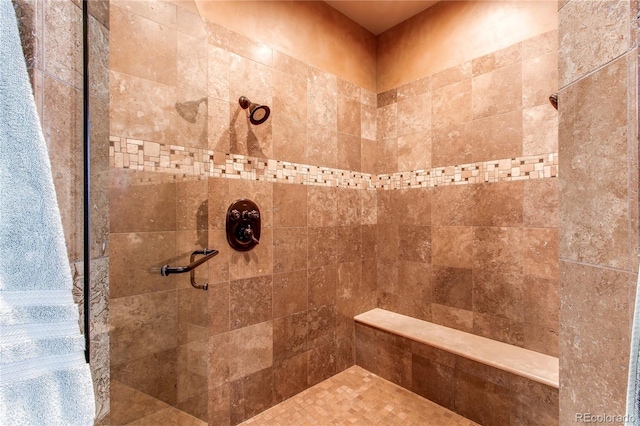 bathroom with a tile shower