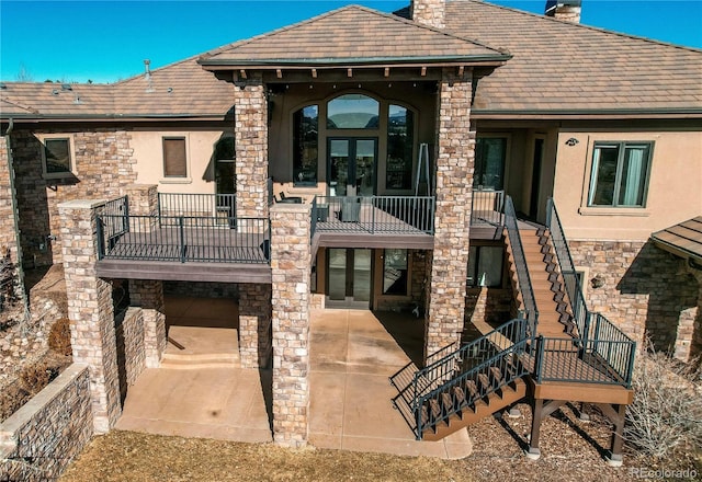 back of house featuring french doors and a patio