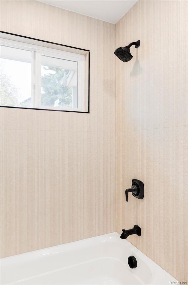 full bath featuring tub / shower combination and wallpapered walls