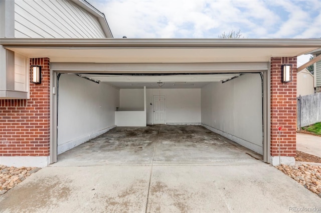 garage with concrete driveway