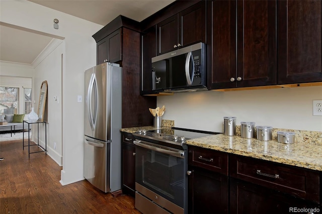 kitchen featuring appliances with stainless steel finishes, dark wood finished floors, light stone counters, and dark brown cabinetry